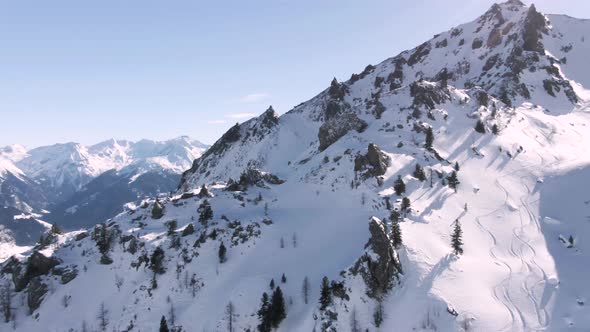 austrian winter mountain landscape for skiing filmed by a drone at a sunny day alt