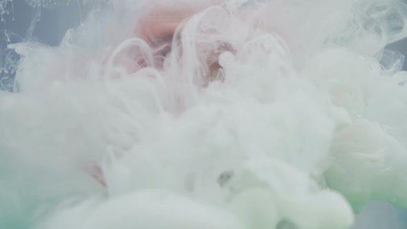 Acrylic Colors Dropped Into Liquid. Abstract Snow Storm in Glass, Dry Ice Science Concept alt