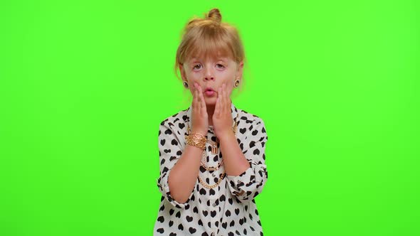 Excited Amazed Child Girl Raising Hands in Surprise Looking at Camera with Big Eyes Wow Victory alt