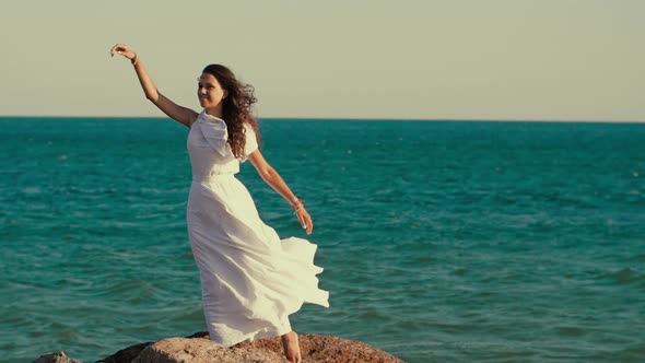 Woman in Dress Posing in the Wind alt