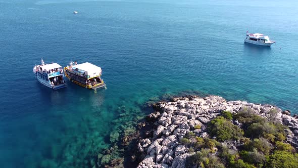 Drone shot of the boats at the sea. alt