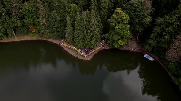 Aerial View of Synevyr Lake Piers with Tourists alt