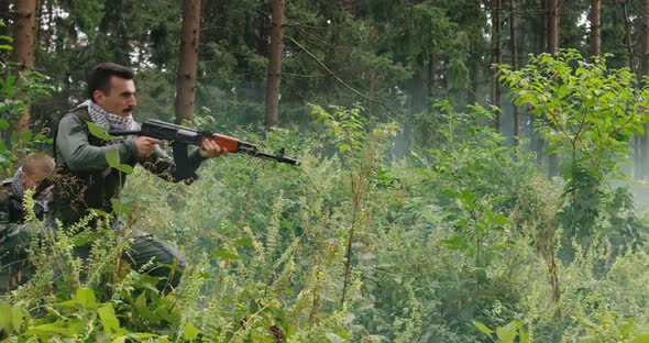 Terrorists Running Thorugh Dense Forest with Smoke or Haze in Backgorund Terrorist in Dangerous alt