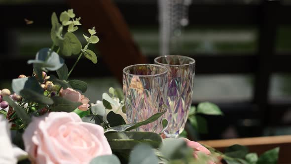 glasses with flowers near the wedding ceremony in summer alt