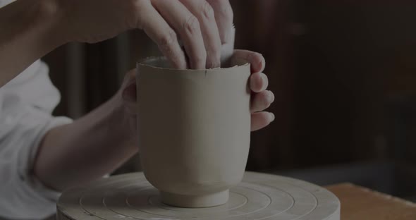Potter Shaping Clay Cup Design