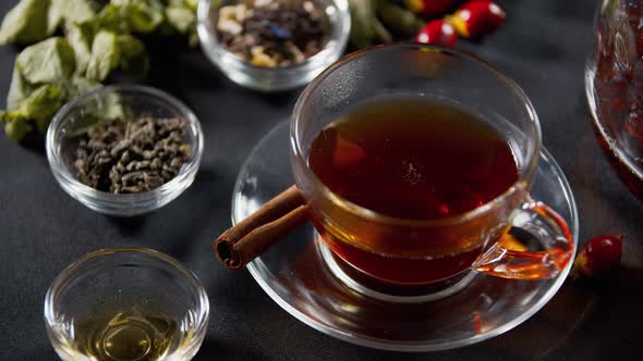 Dropping a Piece of Lemon Into a Cup of Black Tea, Healthy Drink,  alt