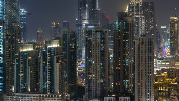 Aerial Cityscape Timelapse at Night with Illuminated Modern Architecture in Downtown of Dubai United alt