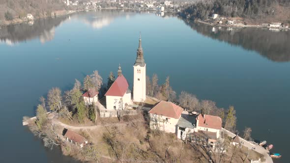 Church on an Island With Snow Capped Mountains