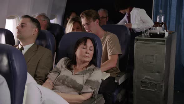 Woman trying to sleep on airplane flight