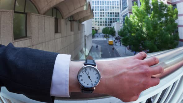 Businessman Checking the Time on His Wristwatch