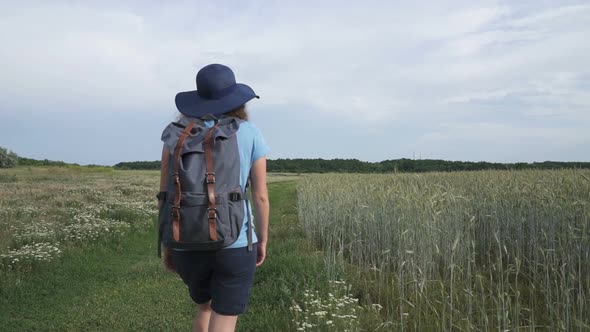 Woman Travels With a Backpack in Beautiful Places