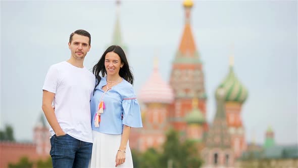 Young Dating Couple in Love Walking in City Background St Basils Church alt