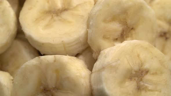 Banana Slices Closeup, Macro Food Summer Background, Fruits Top View. Rotate alt