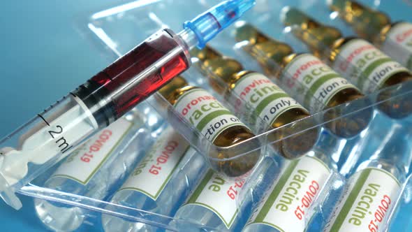 Covid19 and Ncov Coronavirus Vaccine Tablets and Syringe alt