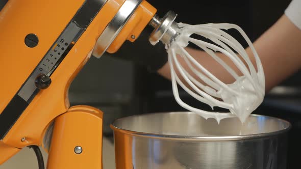 The Gloved Pastry Chef Stops the Mixer Lifts and Detaches the Whisk From the Mixer
