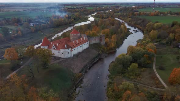 Bauska Medieval Castle Ruins Complex and Park From Above Aerial Shot 4K Video alt
