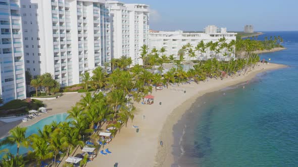 Marbella seafront hotel, Hemingway beach, Juan Dolio in Dominican Republic. Aerial sideways alt
