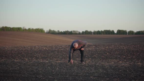 The Agronomist Checks the Ascent of the Crop on a Large Field