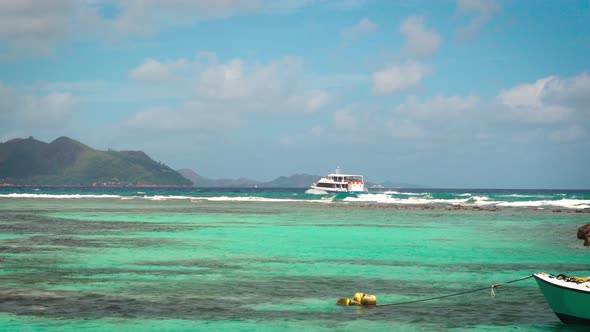 Ferry Sailing Towards Praslin Island From La Digue Island in Seychelles alt