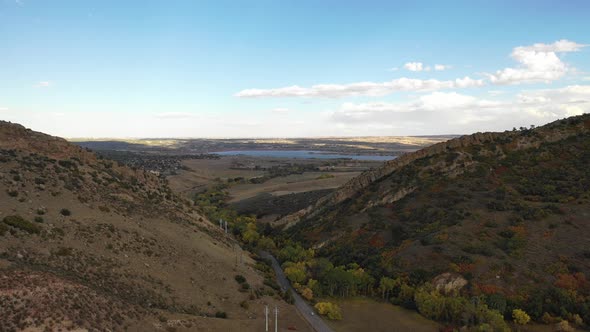 A pan over deer creek, Littleton Colorado as the fall colors start to apprea alt
