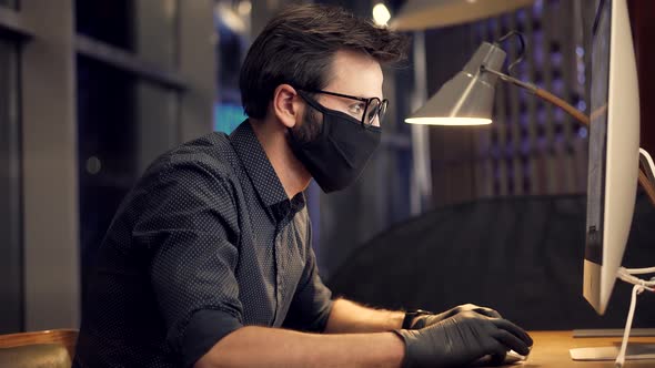 Man In Face Mask Working In Office. Businessman In Mask Protection Epidemic Coronavirus. Conference. alt