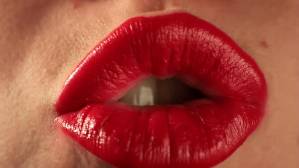 Kisses by woman mouth close up