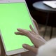 Woman Swiping On Green Screen Display Of Tablet - VideoHive Item for Sale
