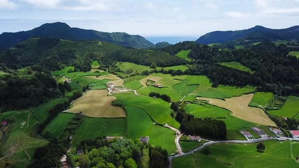 Aerial Shot above Greenish Agriculture area in Sao Miguel Island, Azores. Portugal alt