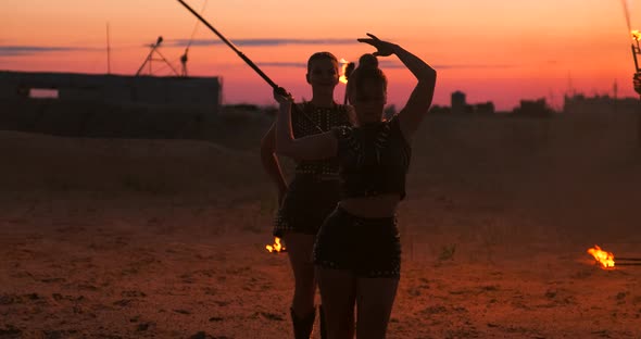 Professional Dancers Women Make a Fire Show and Pyrotechnic Performance at the Festival with Burning alt