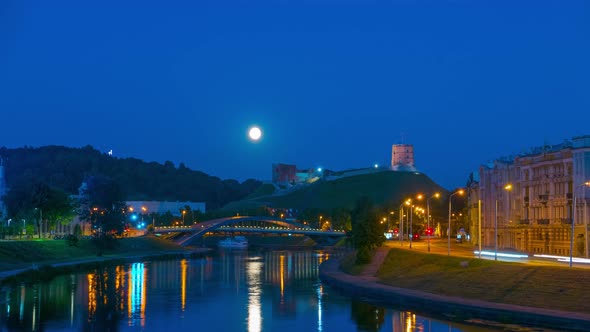Night Vilnius, Gediminas Tower, the River Neris and the Rising Moon  alt