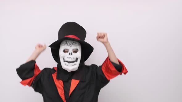 Halloween Kids Happy Dancing Boy in Halloween Skeleton Costume Trick or Treating