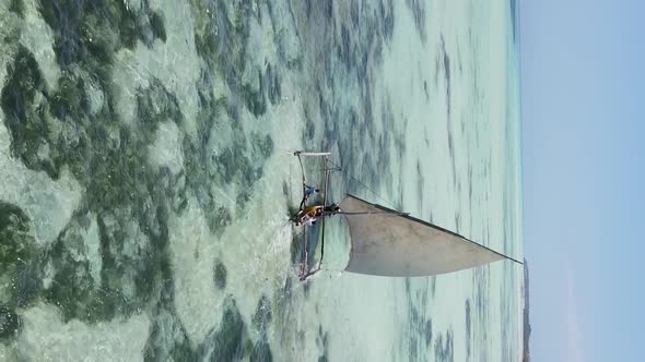 Vertical Video Boats in the Ocean Near the Coast of Zanzibar Tanzania Aerial View alt