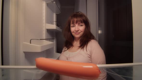 Woman Opens Refrigerator with Spoiled Sausage Unpleasant Smell