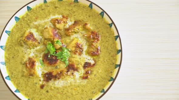 Afghani chicken in green curry or Hariyali tikka chicken hara masala - Indian food style alt
