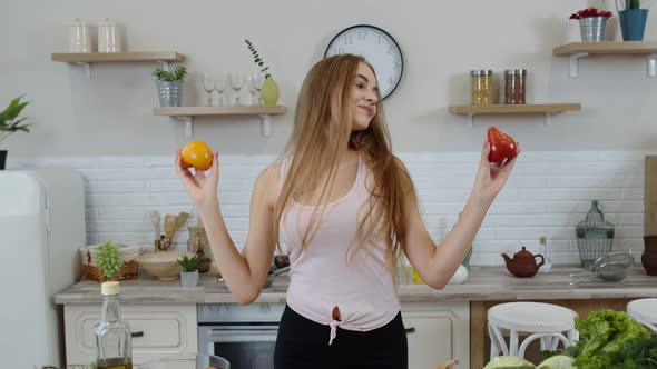 Girl Recommending Eating Raw Vegetable Food. Showing Tomatoes in Hands. Weight Loss and Diet Concept alt