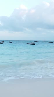 Boat Boats in the Ocean Near the Coast of Zanzibar Tanzania Slow Motion Vertical Video alt