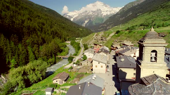 Aerial view of Lanslebourg village and snow peak mountain, Savoie, France. alt