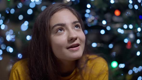 Closeup Portrait of Charming Smiling Young Middle Eastern Woman Closing Eyes Making a Wish on alt
