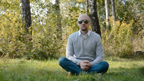 Loneliness Concept Man Sitting in Summer Forest alt