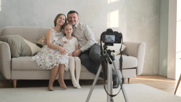 Happy Family Taking Photos with Digital Camera alt