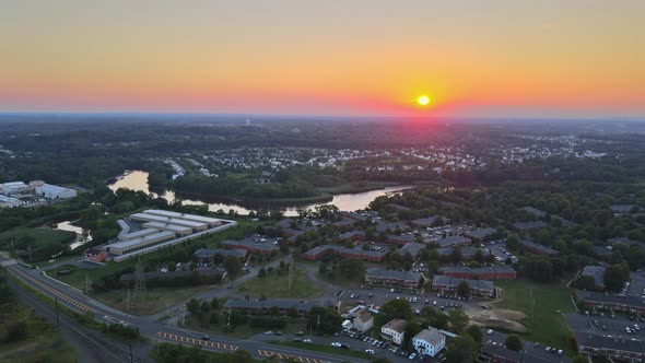 Aerial View of Residential Town Areas Along the River with Private Houses in Skyline Sunset alt
