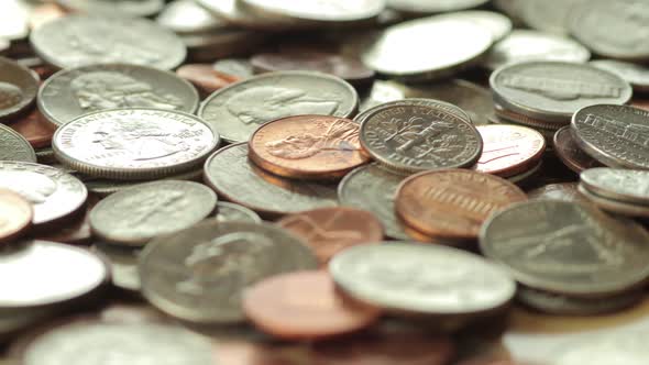 Dolly Past Pile Of US Coins alt