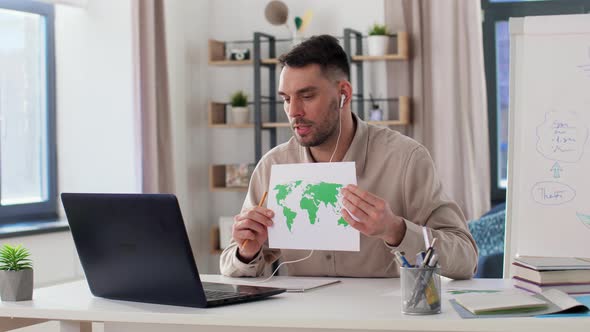 Teacher with World Map Having Online Class at Home