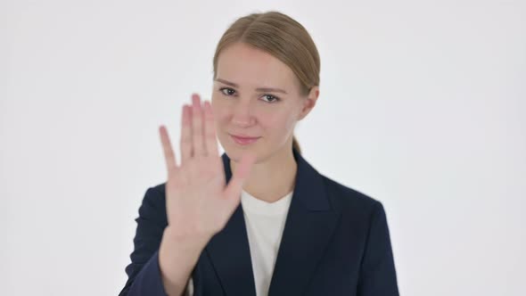 Young Businesswoman Showing Stop Sign on White Background alt