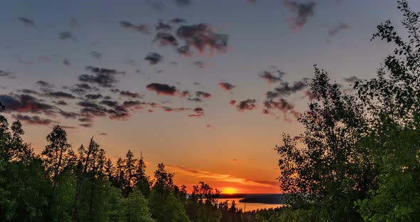 Beautiful Evening Sunset Landscape with a Span of Time, Forest and River in the Distance alt