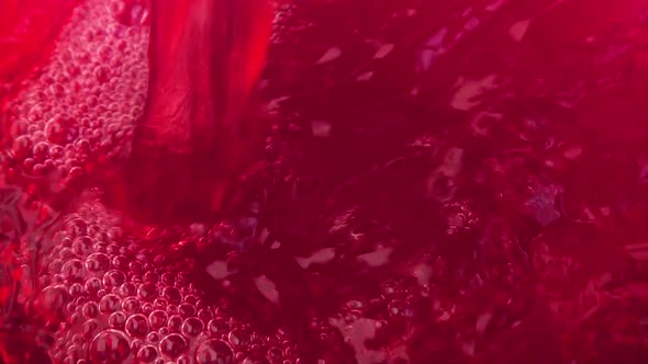 Pouring and splashing the juice of Sicilian oranges. Slow motion. alt