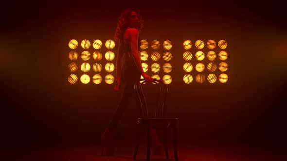 Girl Dancer Walking Sexually Near Chair Nightclub alt