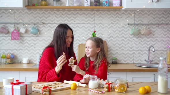 Happy Family Mother and Daughter Bake Cookies for Christmas