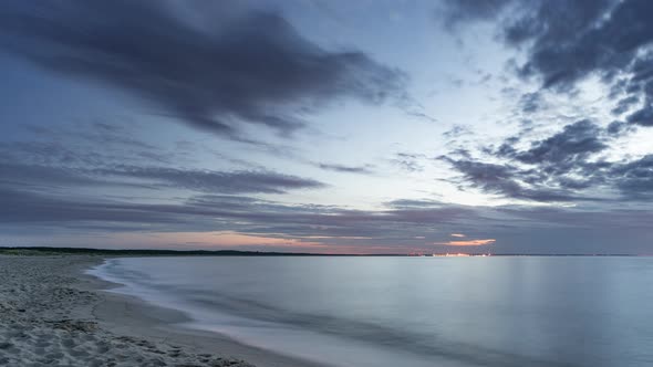 Stratus Layered Clouds Moving on a Sky on Sunset over Baltic Sea in a Bay near Gdansk, Poland