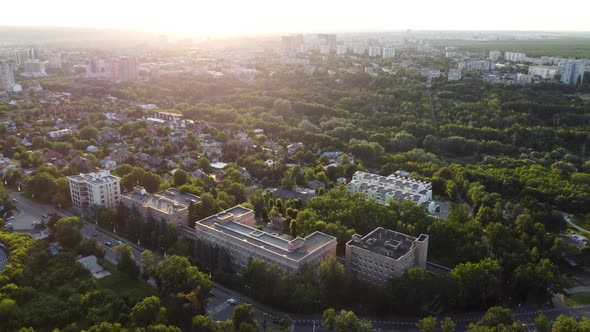 Green city park aerial near residential buildings